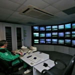 man monitoring screens