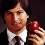 Steve Jobs holding an apple