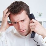 guy stressed out on phone